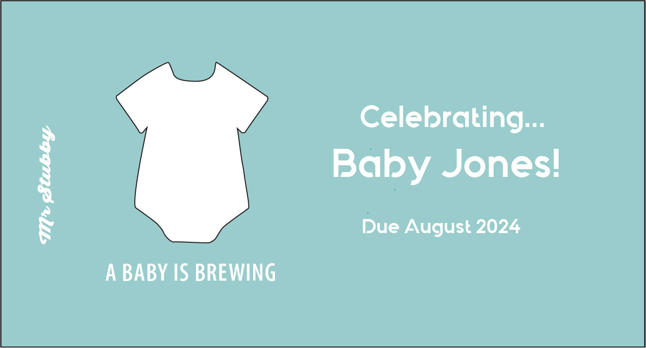 Baby shower stubby holder with a white onesie outline and text on a light blue background
