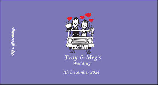 Wedding invitation card with cartoon bride and groom in a car, hearts, and text on a purple background.